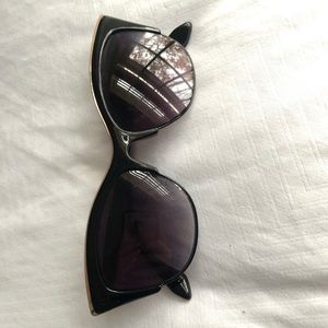 Black cat eye sunglasses with gold frame detail